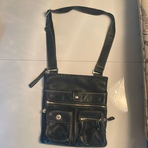 Black leather roots purse . Shoulder strap
